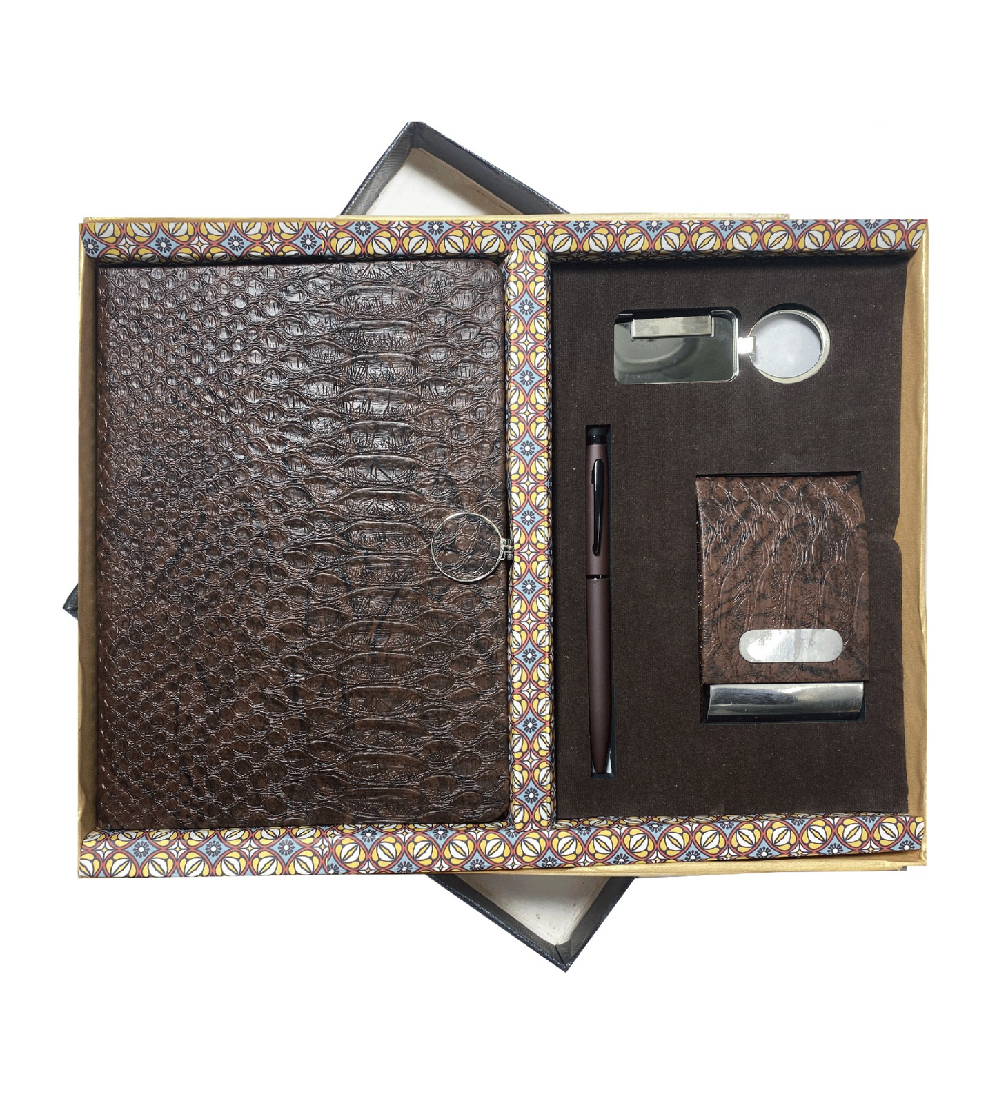 The Verveet Croco Executive Set, a luxurious and stylish corporate gift collection. This set includes a premium croco-textured leather notebook, a matching pen, a sleek keyholder, and a sophisticated cardholder. Perfectly designed for executives, it offers a blend of elegance and functionality, making it an ideal gift for professional occasions. The set is presented in a refined packaging to elevate the gifting experience.