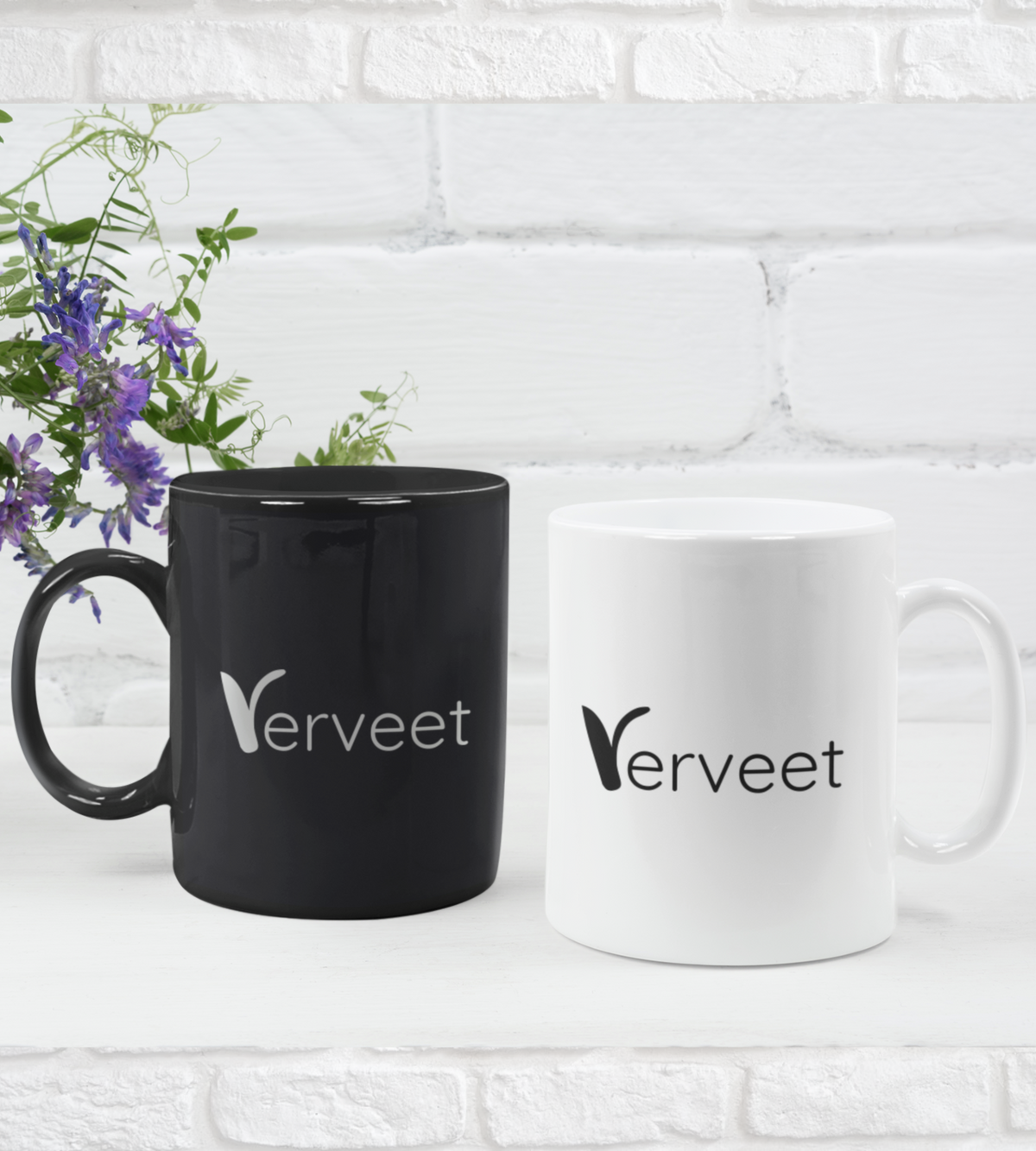 Branded office mugs in black and white for employee onboarding kits