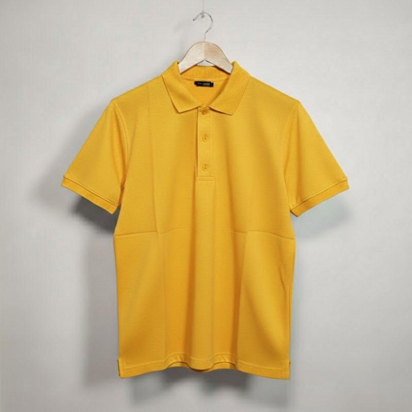 Dot-knit fabric polo T-shirt close-up texture, breathable corporate polo T-shirt material for uniforms and branding